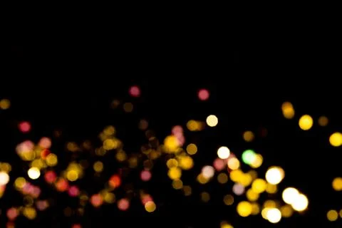 Glitter lights on black background Stock Photos
