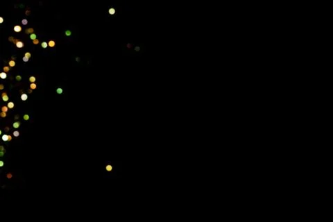 Glitter lights on black background Stock Photos