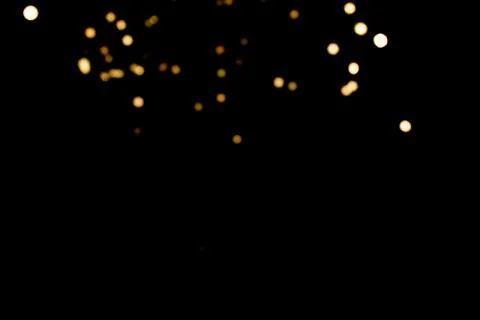 Glitter lights on black background Stock Photos