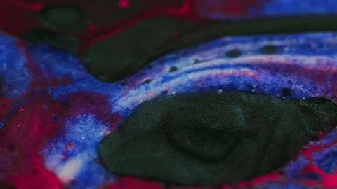 Glitter liquid ink mix red black blue oil spots Stock Footage 280096231