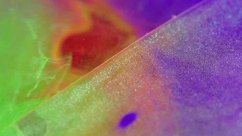 Glitter mist oil bubble neon gel ink drop floating Video stock 266961990