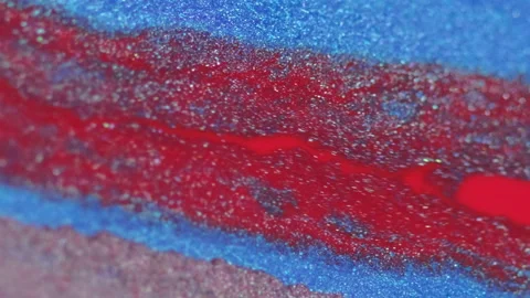 Glitter paint spill fluid background red blue ink Stock Footage 265048997