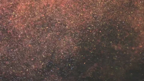The glitter particles flying on the dark background. slow motion Stock Footage 160065020