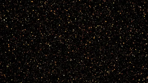 Glitter particles shine shiny sparkle small circles orange gold yellow dotted Stock Footage 317577761