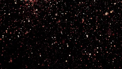 Glitter particles in slow motion falling down against black background Stock Footage 327597307