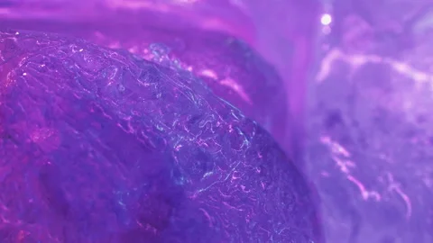 Glitter pollution microplastic colorful stains on ice Stock Footage 233918015