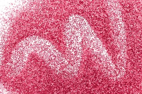 Glittering background of red sequins isolated on a white background closeup.  Stock Photos