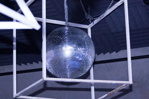 A glittering ball in a cube Stock Photos