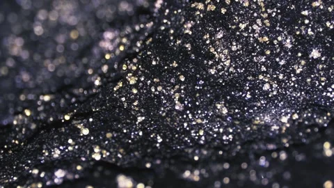 Glittering Black Surface with Sparkling Gold and Silver Particles Stock Footage 340555256
