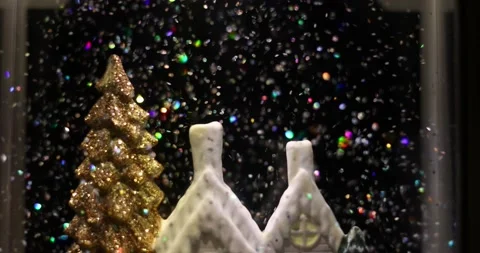 Glittering colored particles flying inside the new year glass ball.	 Video stock 168181337