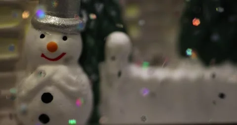 Glittering colored particles flying inside the new year glass ball. Video stock 168181409