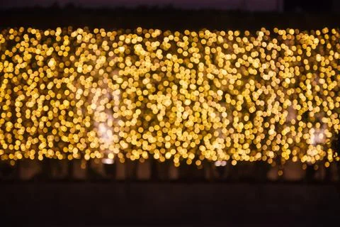 Glittering Glowing and Sparkling defocused Blinking Warm Gold Light (bokeh) I Stock Photos