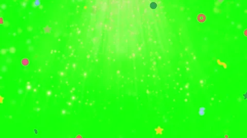 Glittering heart shape forms on green background with colorful confetti Stock Footage 337447995