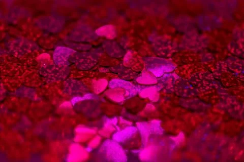 Glittering hearts background Stock Photos