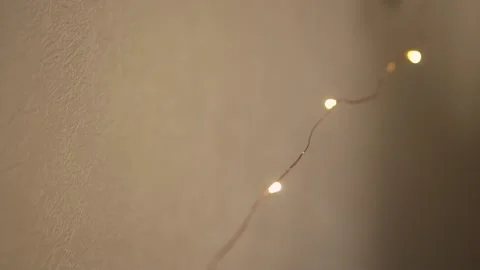 Glittering Lights. Garland thread with Yellow lamps. Festive atmosphere. lights. Stock Footage 137311124