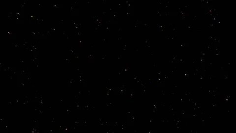 Glittering particles sparkle and drift along. Abstract background with shining Stock Footage 97751854