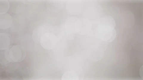 Glittering soft silver white bokeh background with flickering light particles. Stock Footage 105650630