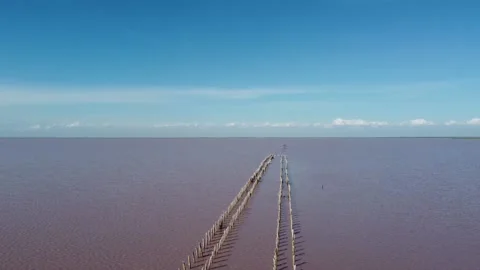 Glittering water surface of red salt lake - stock video Stock Footage 157885431