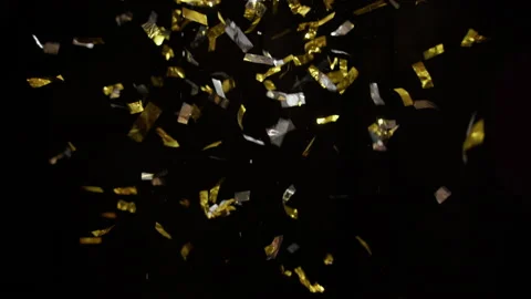 Glitters And Confetti Falling On A Black Background Stock Footage 233460634