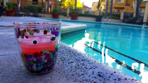 Glittery Pink Cocktail by the Pool Stock Footage 77065868