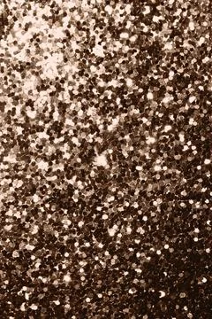 Glittery texture in warm tones showcasing chic aesthetic for designs Stock Photos