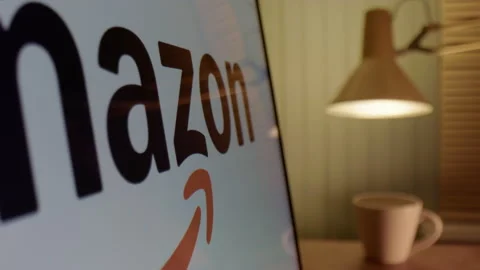 Global e-commerce online retailer Amazon logo displayed on screen with white Stock Footage 300875058