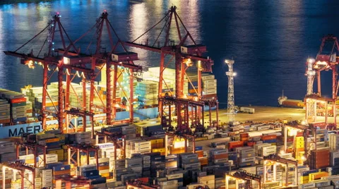Global freight shipping and export with cranes loading cargo in commercial port Stock Footage