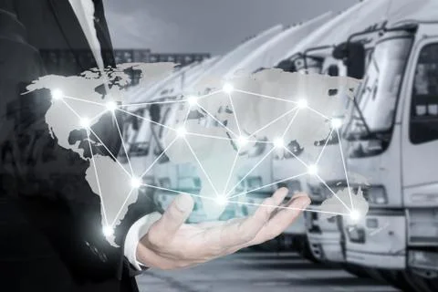 Global logistics network map on hand of businessman, container cargo for Logi Stock Photos