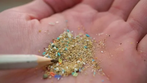Global ocean pollution concept with microplastics bits and pieces from single Stock Footage
