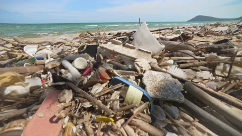 Global Ocean Pollution. A Huge Amount of Plastic Debris is Thrown out by Ocean Video stock 238801872