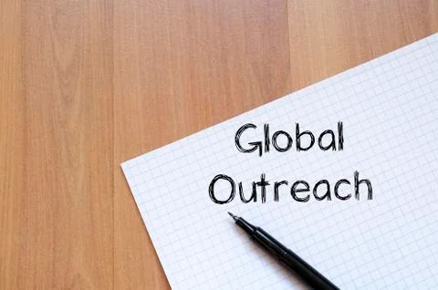 Global outreach write on notebook Stock Photos