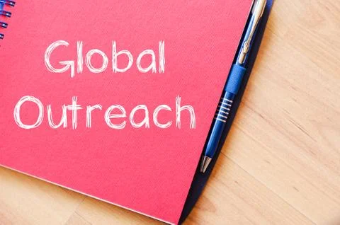 Global outreach write on notebook Stock Photos
