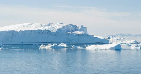 Global Warming and Climate Change - Icebergs from melting glacier in icefjord Stock Footage 136562567