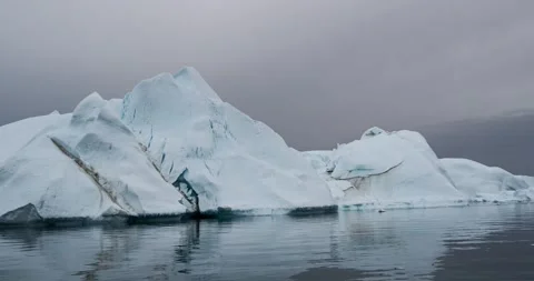 Global Warming and Climate Change - Icebergs from melting glacier in icefjord Stock Footage 167929771