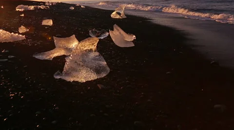 Global Warming Climate Change Concept. Icebergs on Black Sand Beach. Stock Footage 51849165