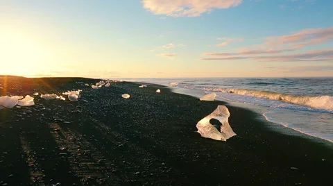 Global Warming Climate Change Concept. Icebergs on Black Sand Beach. Stock Footage 51849187