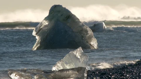 Global warming climate change ocean wave beat iceberg floe broken from glacier Video stock 94411900