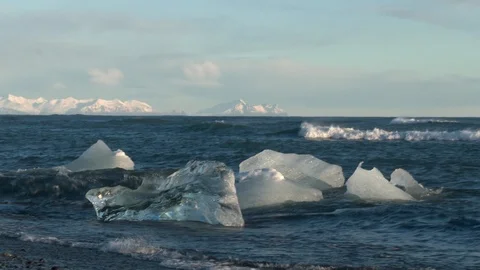 Global warming climate change ocean wave beat on iceberg ice floe broken glacier Stock Footage 94412440
