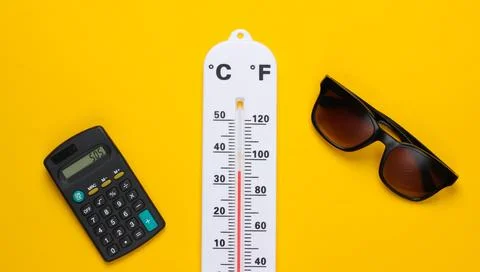 Global warming concept. Climate control. Weather thermometer and calculator,  Stockfoto's