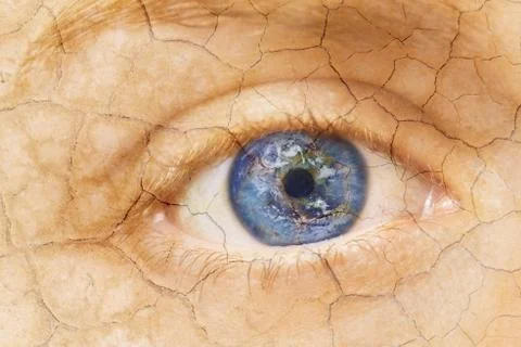 Global warming concept. Close up image of woman cracked textured face with iris Stock Photos