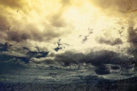 Global warming concept landscape. Dramatic cloudy sky and dry earth Stock Photos