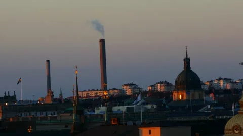 Global warming A factory working in the middle of the city - smoke air pollution Stock Footage 62869567