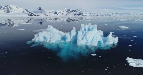 Global warming problem: iceberg melting at polar ocean bay aerial. Nature Stock Photos