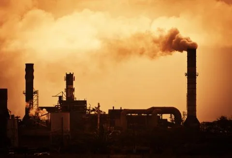 Global warming smoke rising from factory Stock Photos