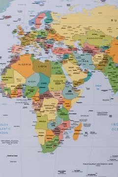 A global world map as a backdrop for themes of trips, travel, hiking, or re.. Stock Photos