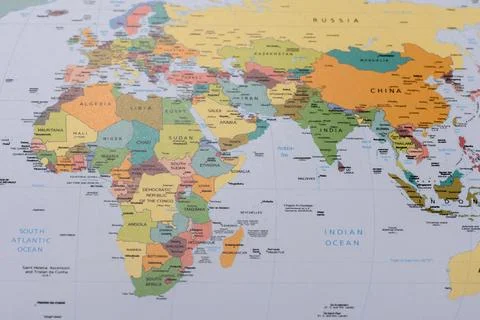 A global world map as a backdrop for themes of trips, travel, hiking, or re.. Stock Photos