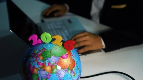 Globe with 2026 in modern office setting, Colorful globe with the year 2026.. Stock Footage 321937313