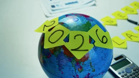 Globe with 2026 Sticky Notes and Calculator, Globe with sticky notes formin.. Stock Footage 321223529