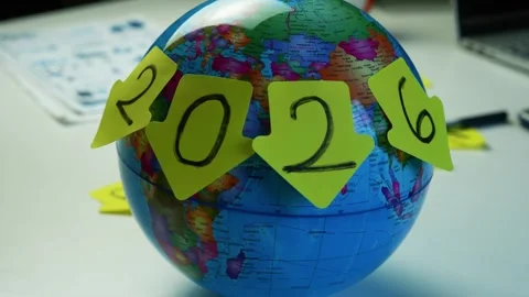 Globe with 2026 Sticky Notes and Calculator, Globe with sticky notes formin.. Stock Footage 321223543