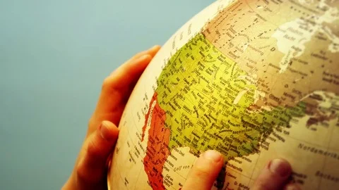 Globe and Childs Hands - USA - 4k Stock Footage 71108367